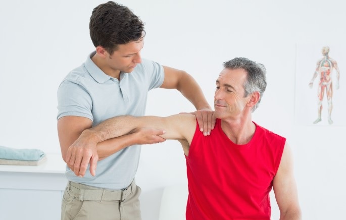 Man Receiving Upper Arm Treatment